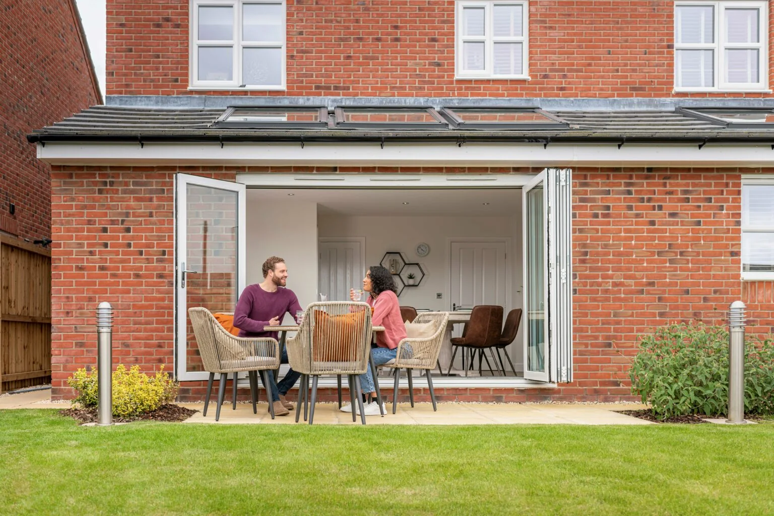Morris-Couple-sat-at-patio-table-4-1-1536x1025